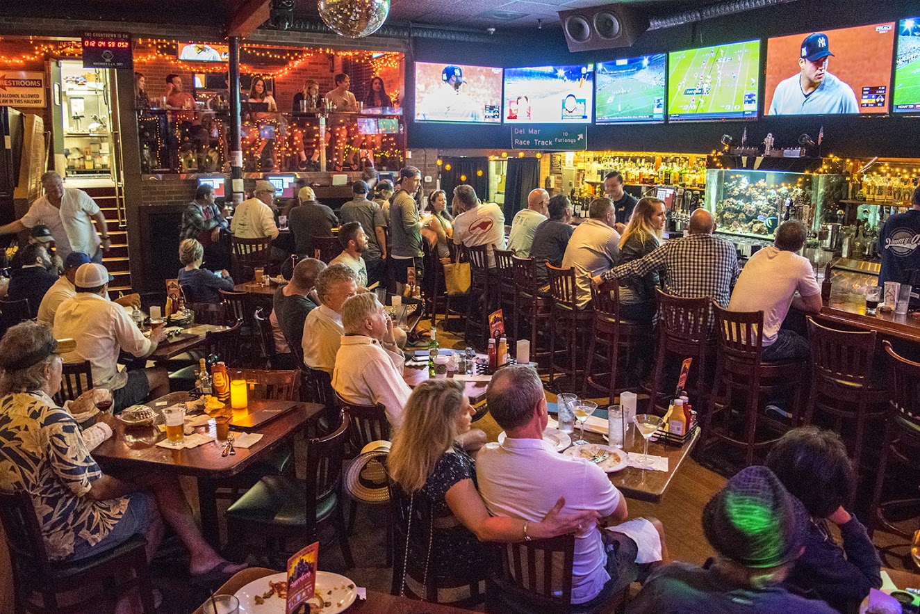 Guests watching a game, drinking